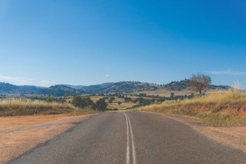Smale Consulting Group image of rolling hills and asphalt road