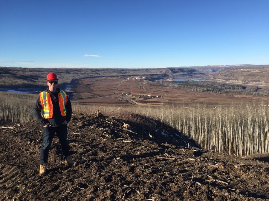 SCG inspector on a ridge overlooking a project site