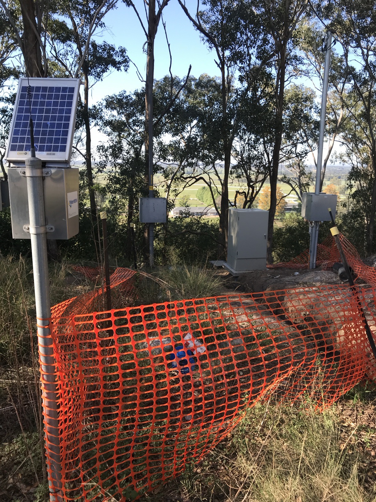 Solar powered environmental monitoring station in bushland above farmland