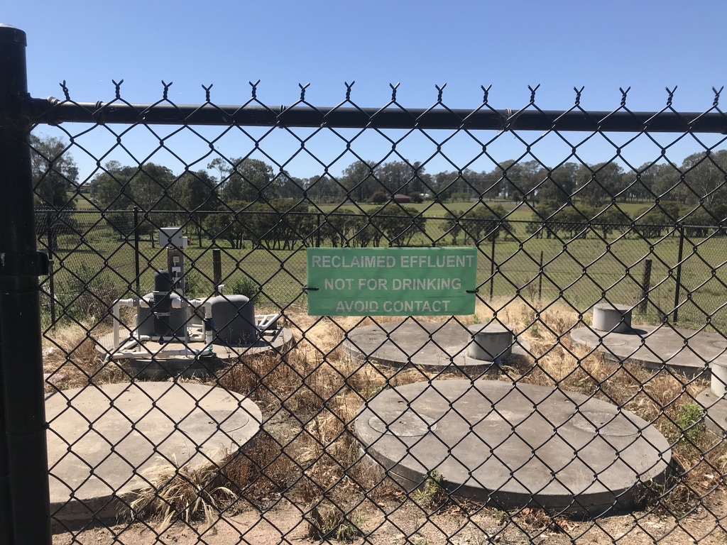 Reclaimed effluent signage at an on-site wastewater treatment compound